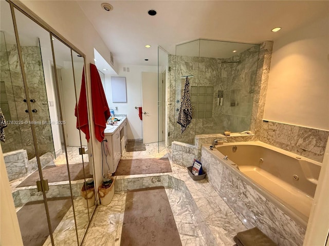 bathroom with vanity, recessed lighting, a shower stall, a jetted tub, and marble finish floor