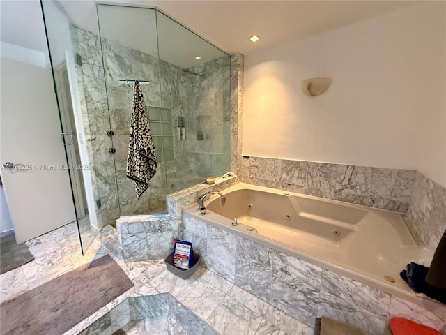 bathroom featuring a tub with jets, a stall shower, and marble finish floor