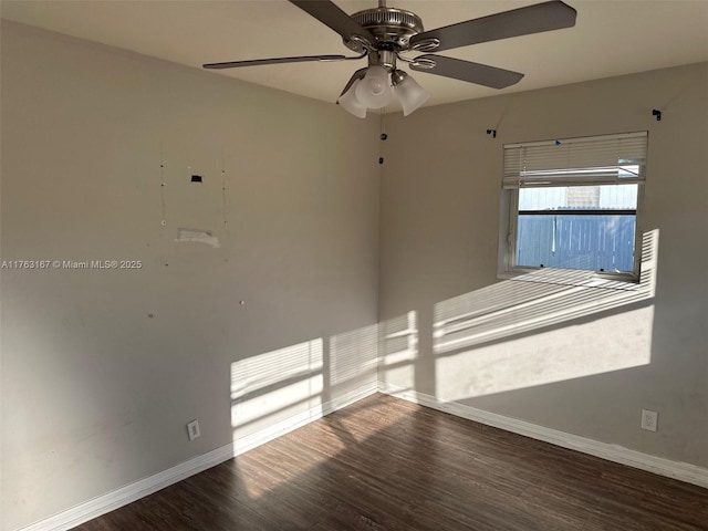 unfurnished room with wood finished floors, baseboards, and ceiling fan