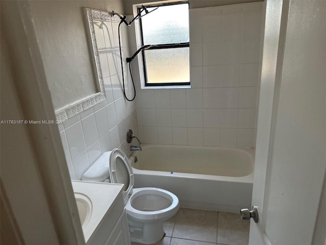 full bathroom featuring tile patterned flooring, toilet, vanity, shower / bathing tub combination, and tile walls