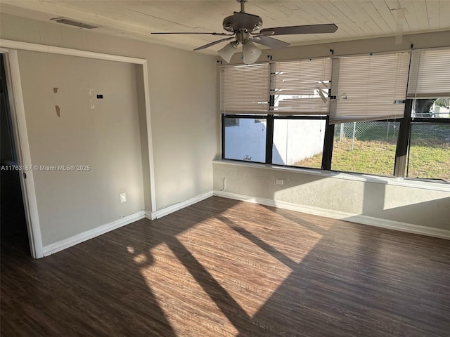 unfurnished sunroom featuring wooden ceiling, visible vents, and ceiling fan