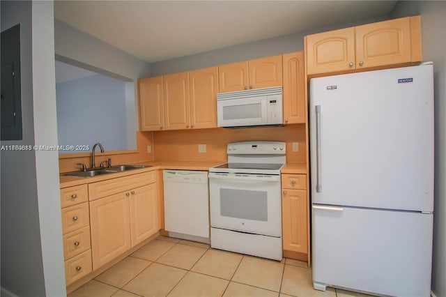 kitchen featuring white appliances, light brown cabinets, light tile patterned flooring, a sink, and light countertops