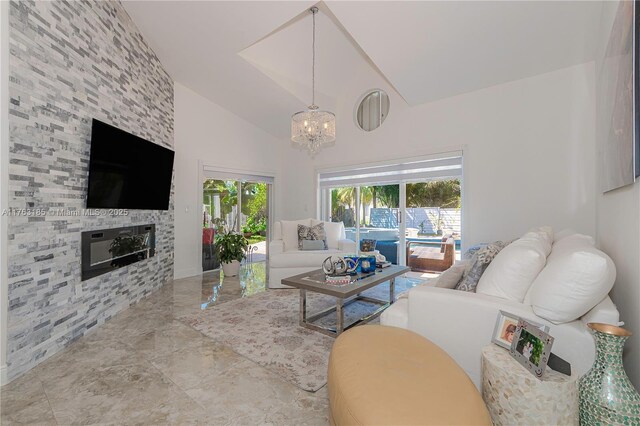 19922 NW 88th Ave, Hialeah, FL 33018 - living area with a chandelier, a fireplace, high vaulted ceiling, and marble tiled floors
