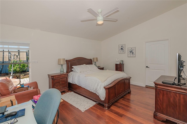 bedroom with lofted ceiling, dark wood-style floors, baseboards, and ceiling fan