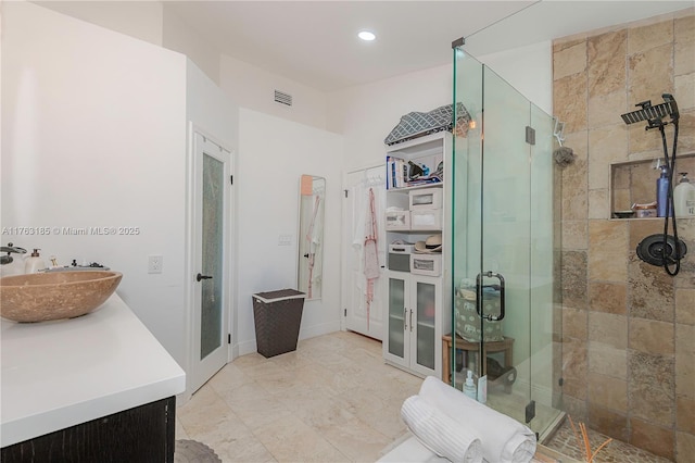 full bath with recessed lighting, visible vents, vanity, and a shower stall