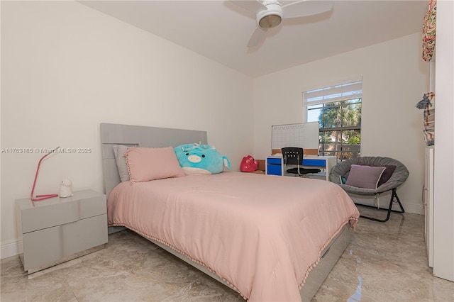 bedroom featuring a ceiling fan and baseboards