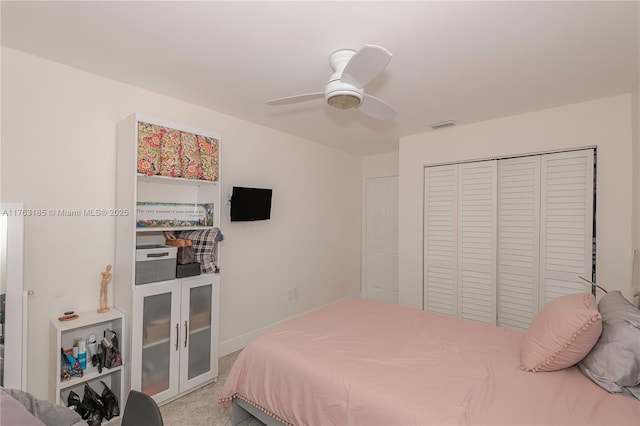 bedroom with visible vents, ceiling fan, french doors, a closet, and light carpet