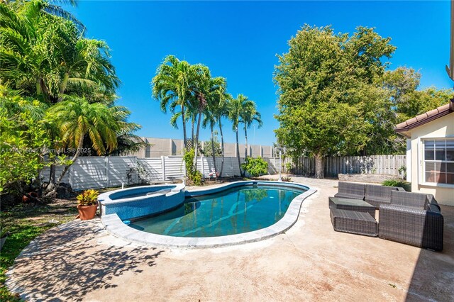 19922 NW 88th Ave, Hialeah, FL 33018 - view of swimming pool with a fenced backyard, a patio area, and a pool with connected hot tub