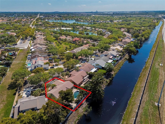 birds eye view of property with a residential view and a water view