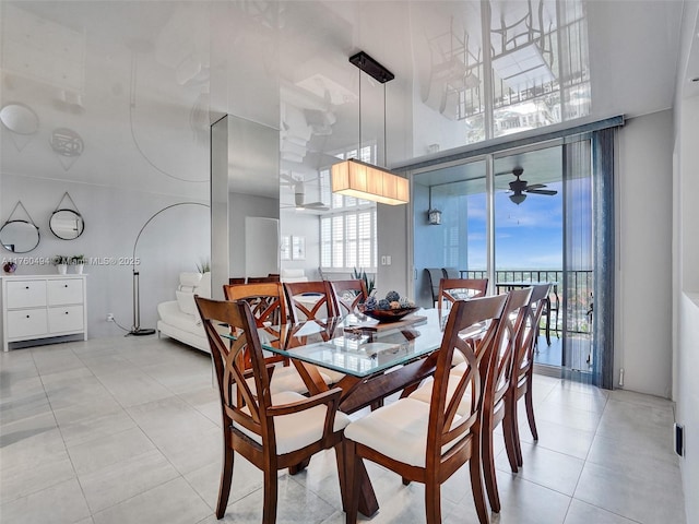 dining area featuring light tile patterned flooring and ceiling fan