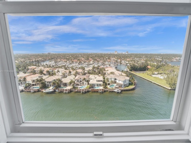 birds eye view of property featuring a residential view and a water view