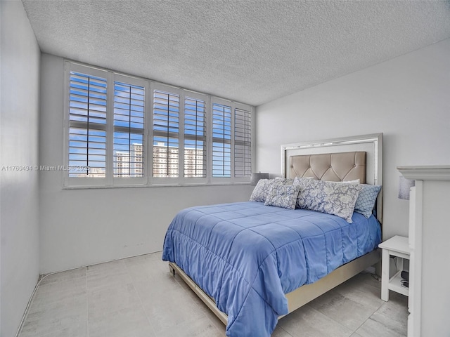 bedroom featuring a textured ceiling