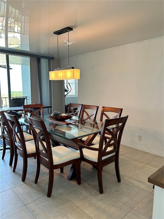 dining space with light tile patterned flooring