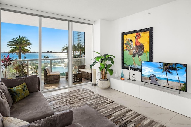 living area with expansive windows and marble finish floor