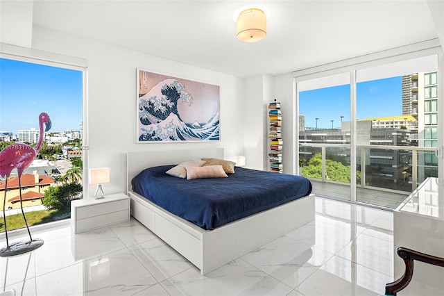 bedroom with access to exterior, floor to ceiling windows, marble finish floor, and multiple windows