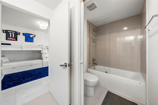 bathroom featuring tile patterned flooring, visible vents, toilet, and shower / tub combination