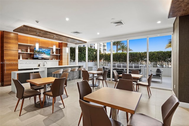 dining space featuring recessed lighting, visible vents, and light tile patterned flooring