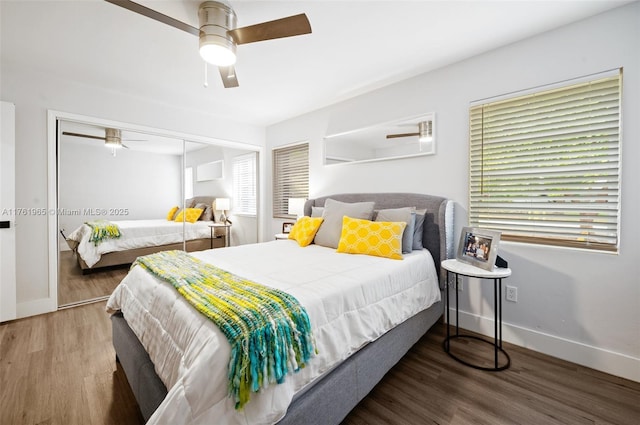 bedroom featuring a closet, ceiling fan, baseboards, and wood finished floors