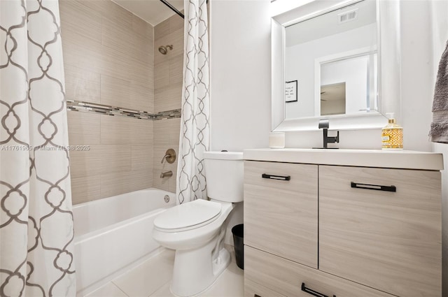 full bathroom with vanity, a shower stall, toilet, and visible vents