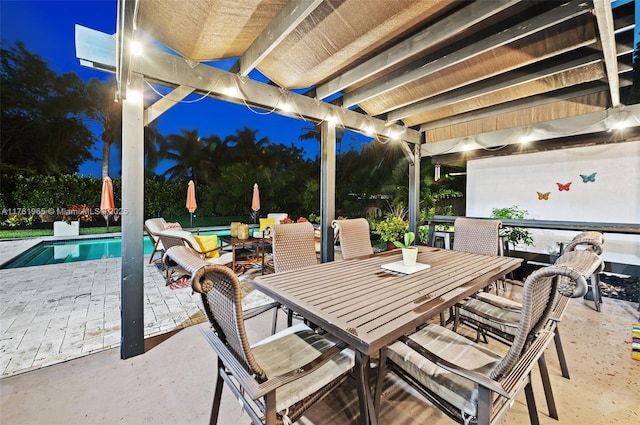 view of patio featuring outdoor dining space and an outdoor pool