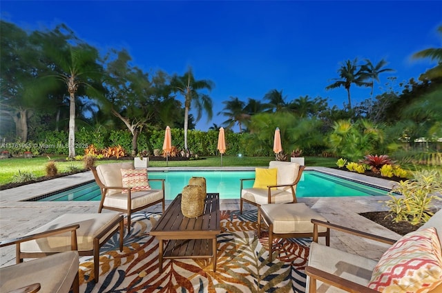view of patio / terrace with outdoor dining space, a pergola, grilling area, a fenced in pool, and an outdoor hangout area
