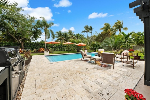 view of patio / terrace featuring outdoor dining space and an outdoor pool