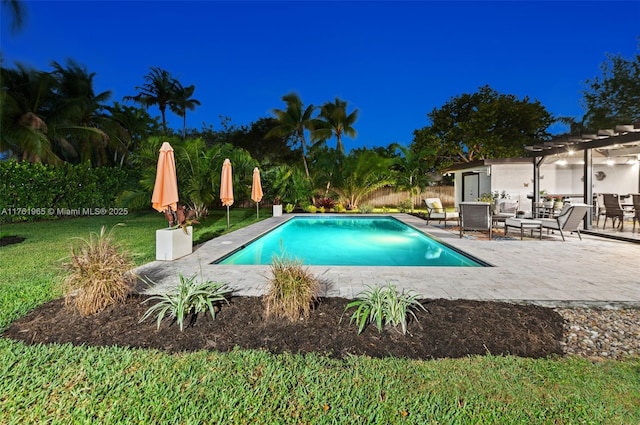 view of swimming pool with a fenced in pool, a patio, a yard, and a pergola