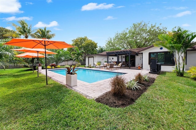 outdoor pool with a yard and a patio area