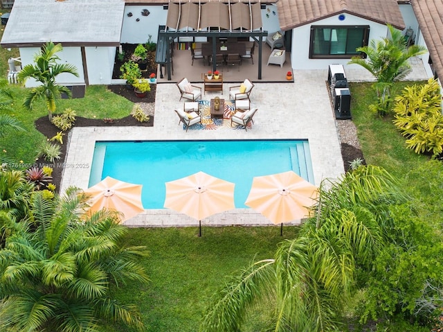 view of home's exterior with a lawn, fence, and stucco siding
