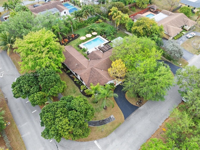 single story home featuring stucco siding, concrete driveway, a garage, and fence