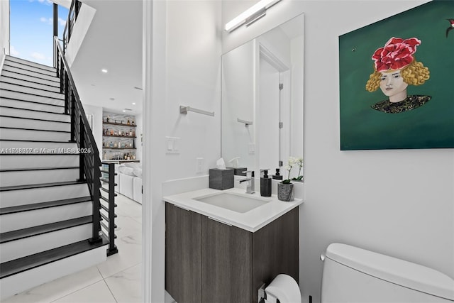 bathroom featuring toilet and vanity