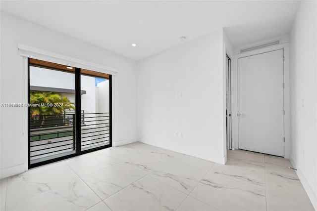 unfurnished room with recessed lighting, visible vents, and marble finish floor