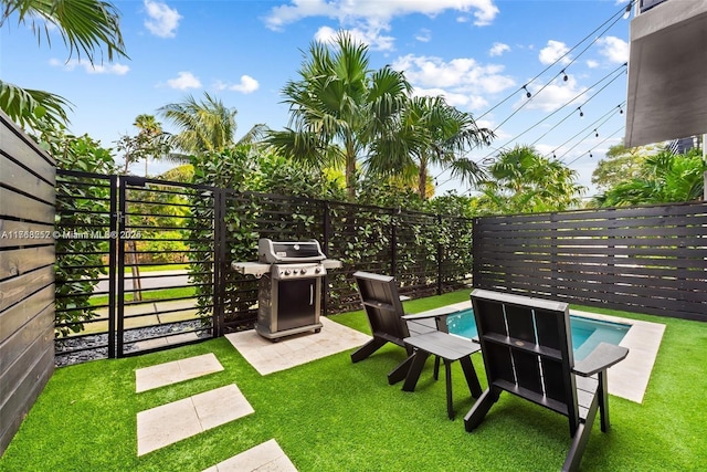 view of yard with a fenced in pool and a fenced backyard