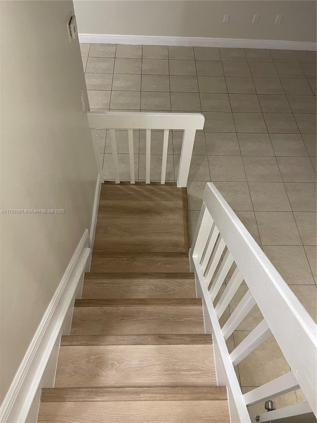 staircase with baseboards