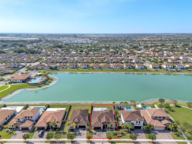 aerial view featuring a residential view and a water view