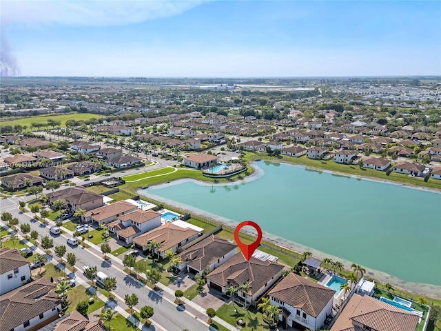 bird's eye view featuring a residential view and a water view