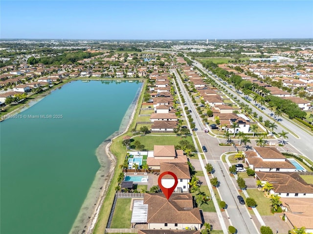 birds eye view of property featuring a residential view and a water view