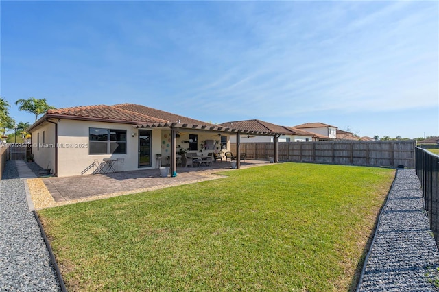 view of yard with a patio and a fenced backyard