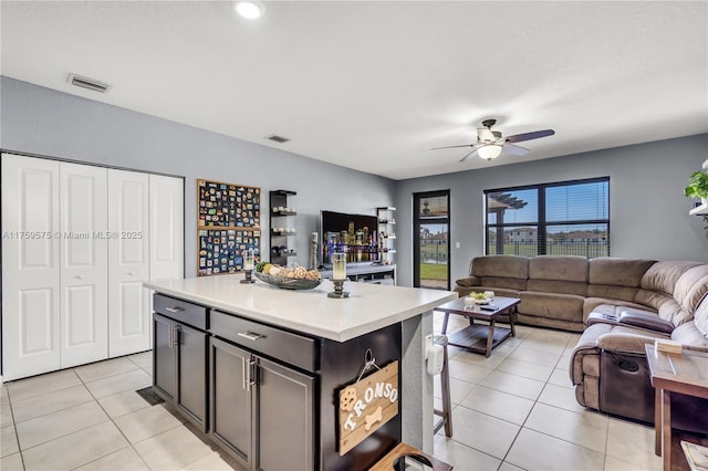 kitchen with light countertops, light tile patterned flooring, visible vents, and ceiling fan