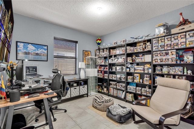 office area featuring a textured ceiling and tile patterned flooring