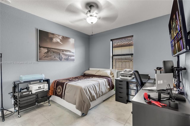 tiled bedroom featuring ceiling fan