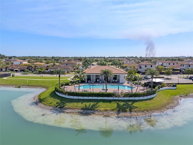 drone / aerial view with a residential view and a water view