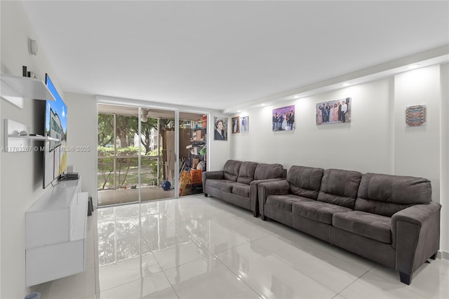 living room featuring floor to ceiling windows