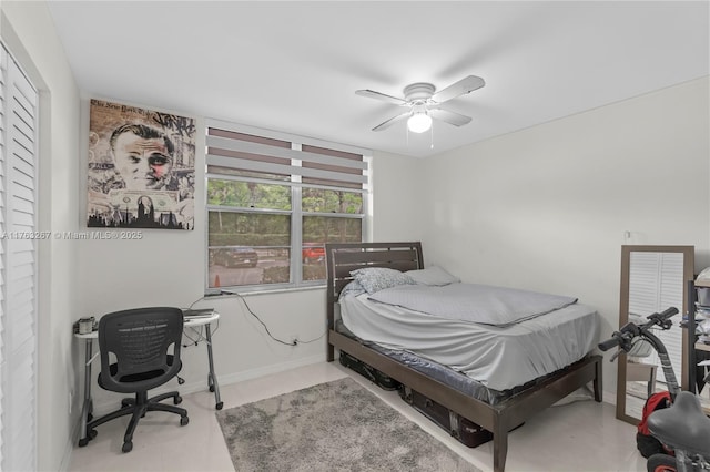 bedroom featuring baseboards and a ceiling fan