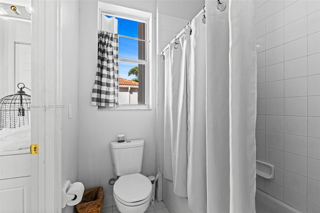 full bathroom with shower / tub combo and toilet