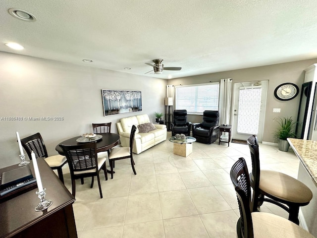 dining room with light tile patterned floors, recessed lighting, a textured ceiling, and ceiling fan