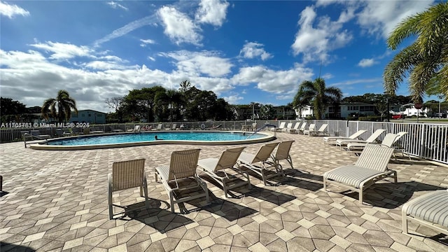 pool featuring a patio and fence