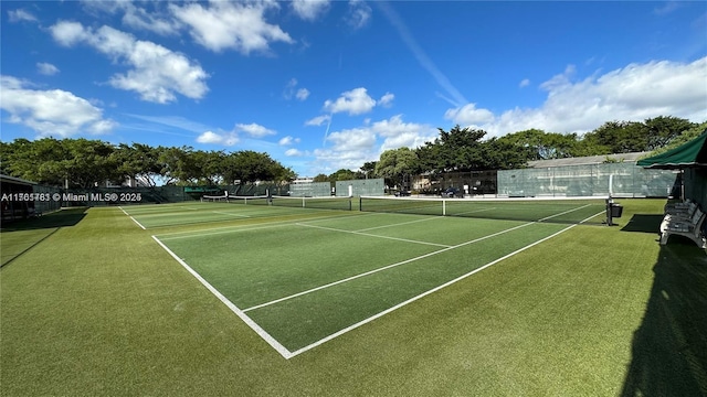 view of sport court featuring fence