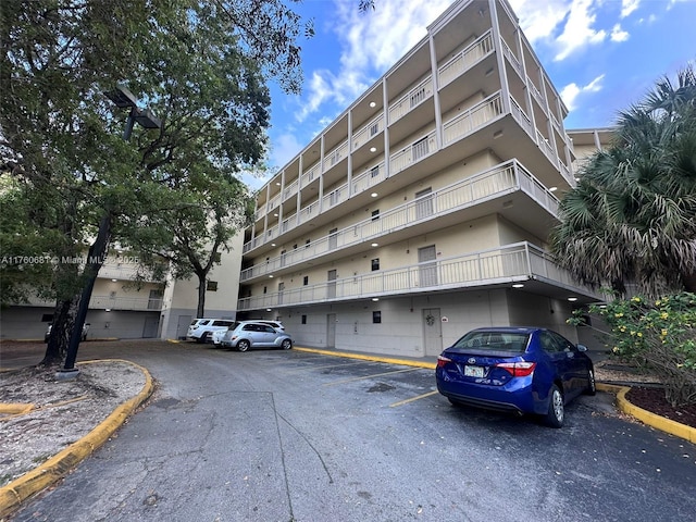 view of property with uncovered parking