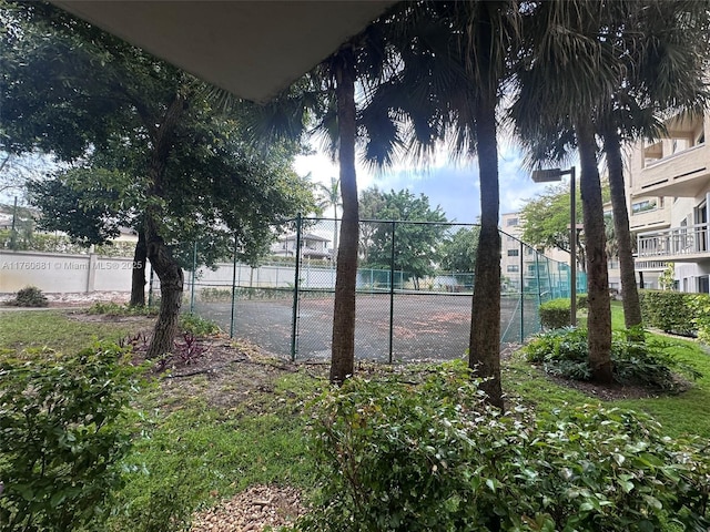 view of tennis court with fence